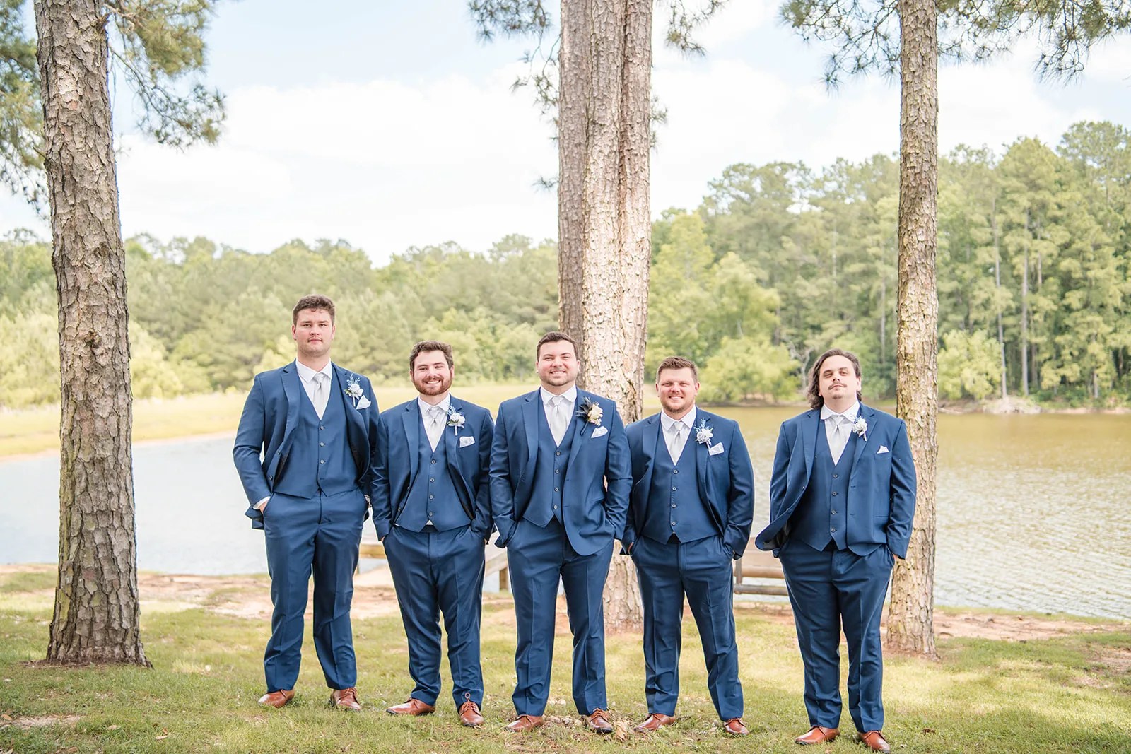 Groomsmen by the lake at Pine Lake Ranch in Montgomery, TX