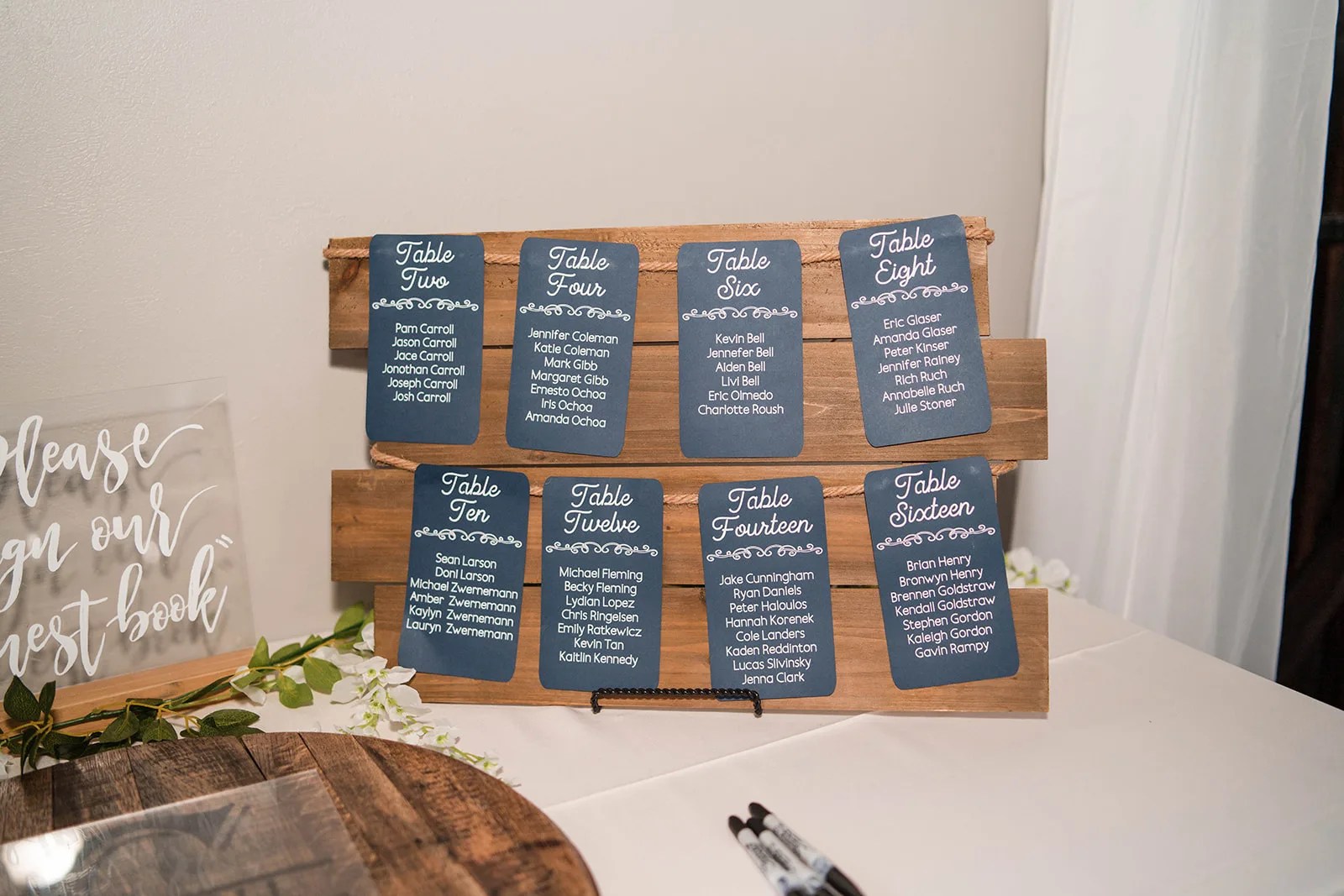 Seating chart display at a wedding at Pine Lake Ranch in Montgomery, TX