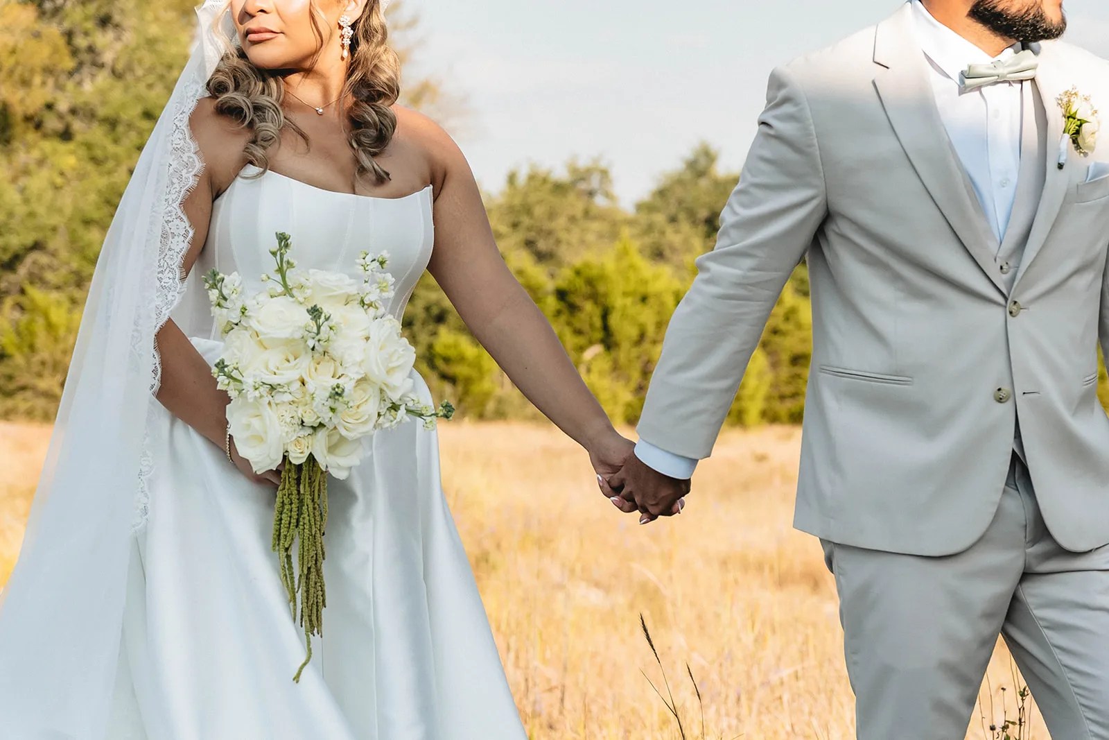 Bride and groom in the field at Prospect House at Prospect House, Dripping Springs, TX