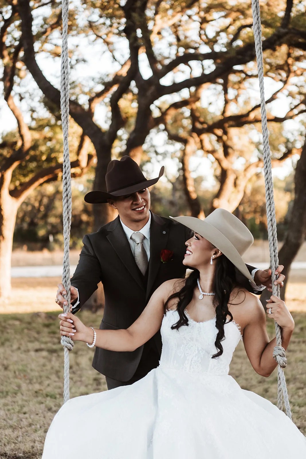 Couple on the swing under the live oaks at Rockin B Ranch at Rockin' B Ranch, Pipe Creek, TX