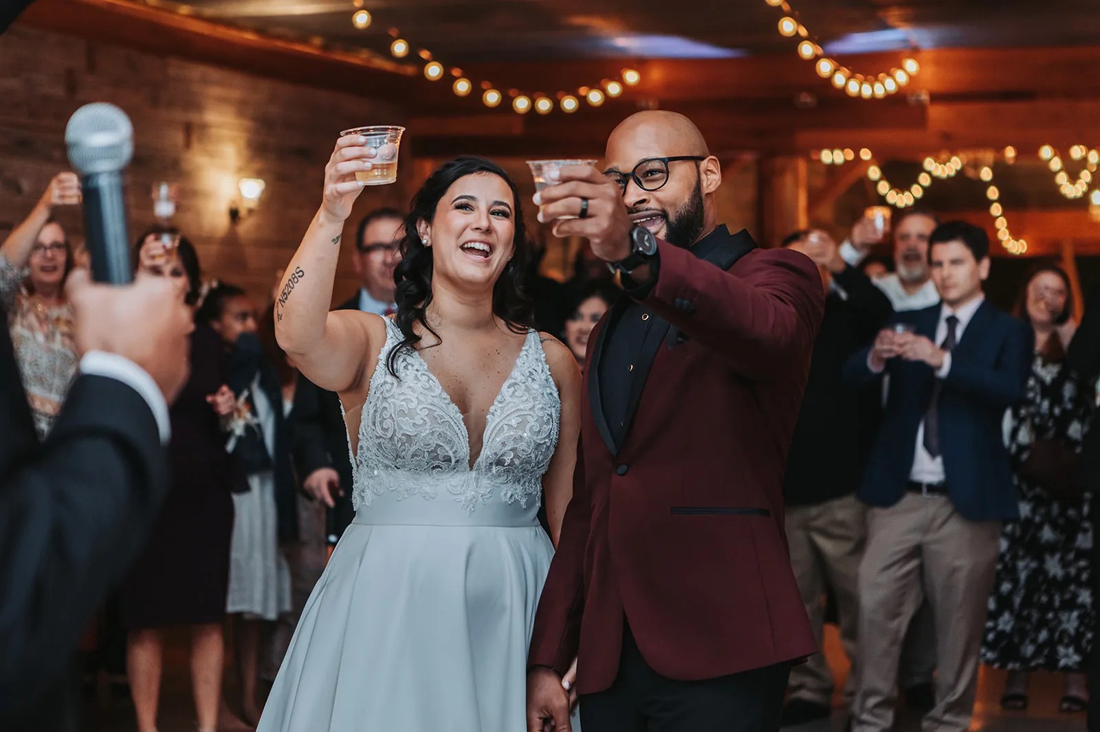Reception in the 1920s red barn at Rustic Grace Estate at Rustic Grace Estate, Van Alstyne, TX