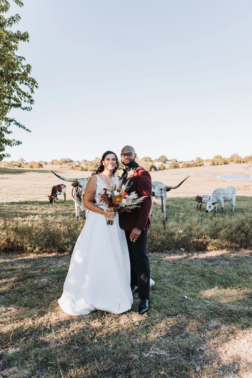 Bride and groom in the meadow at Rustic Grace Estate at Rustic Grace Estate, Van Alstyne, TX