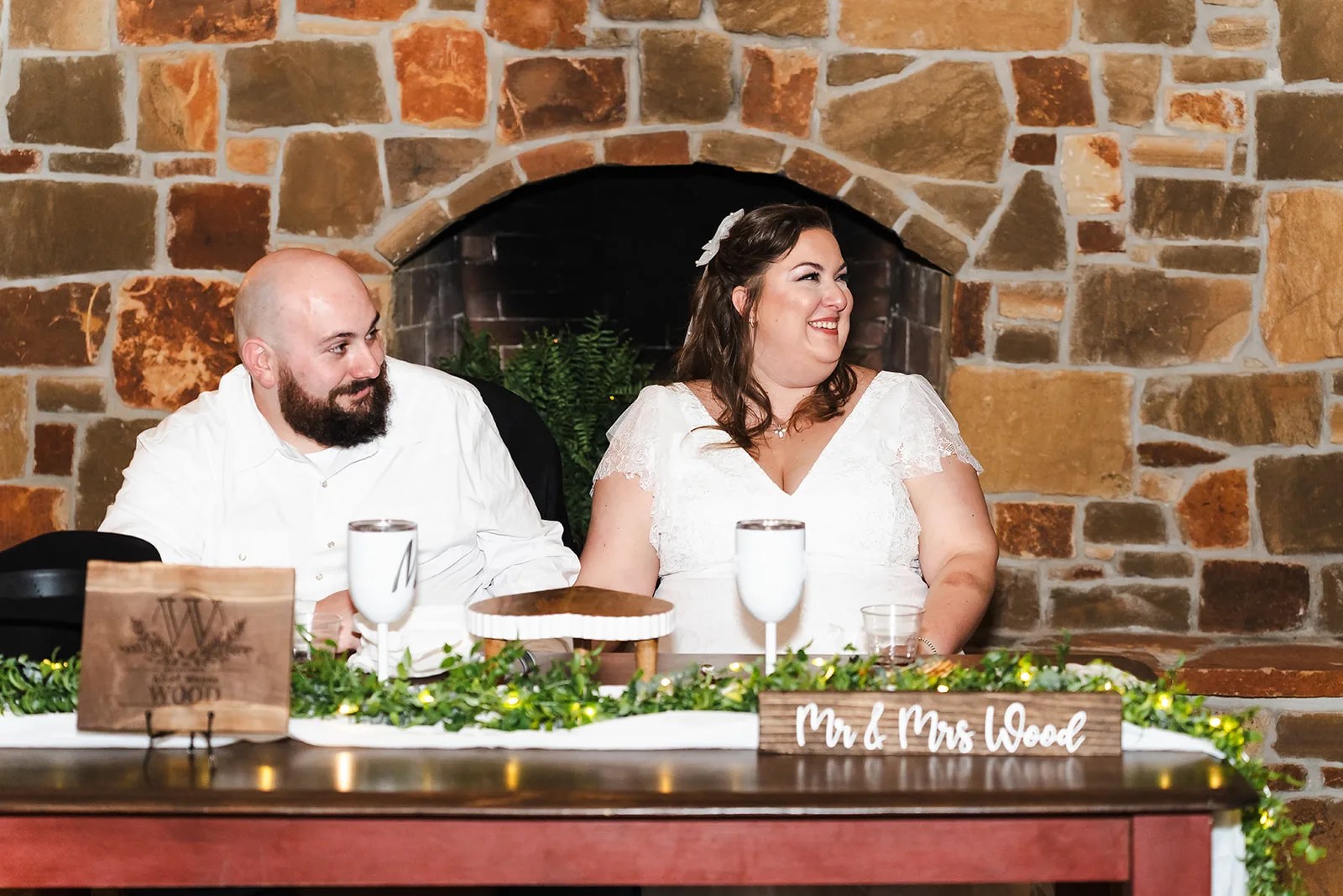Couple at the rock wall at Rustic Rose Events in Willis, TX