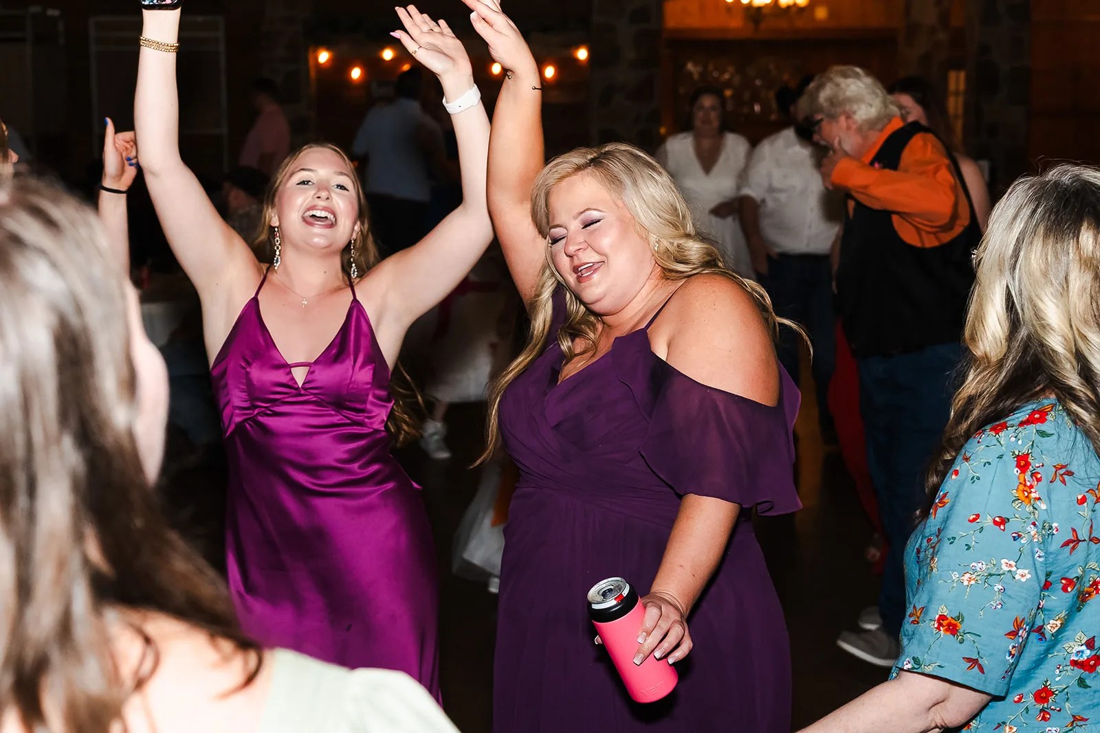 Guests dancing in the barn at Rustic Rose Events in Willis, TX