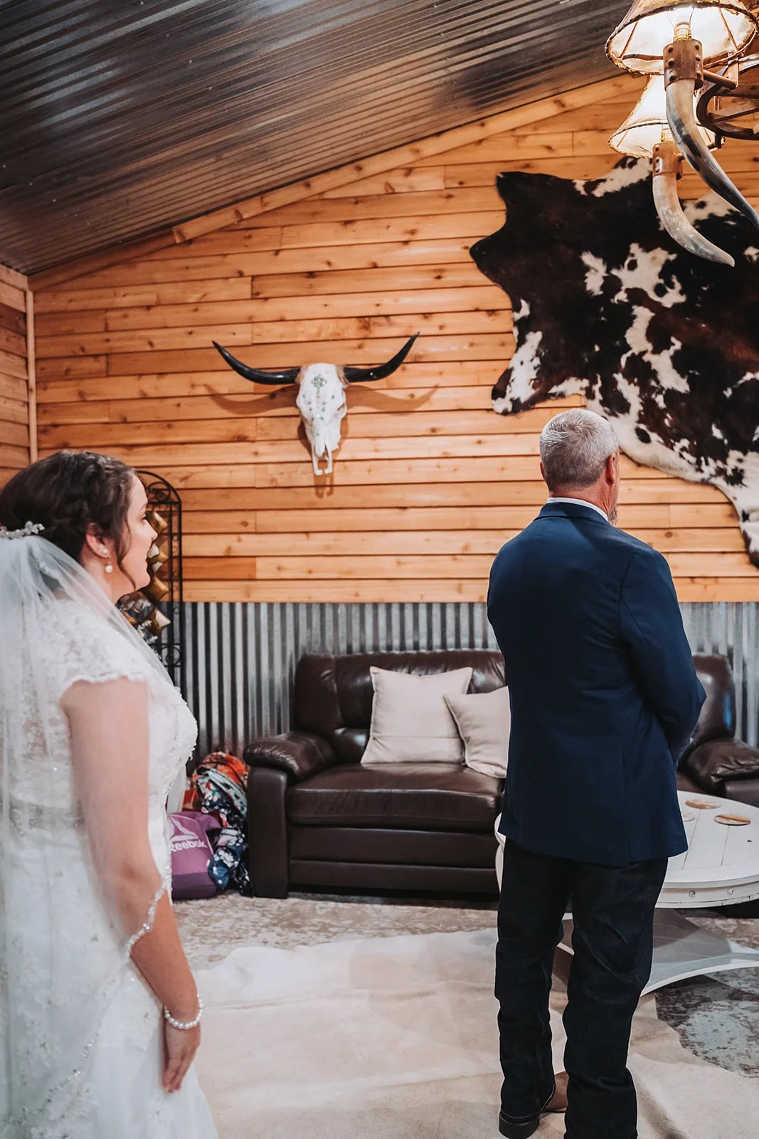 Pine and metal interior with a longhorn skull at SJP Ranch, Cleveland, TX