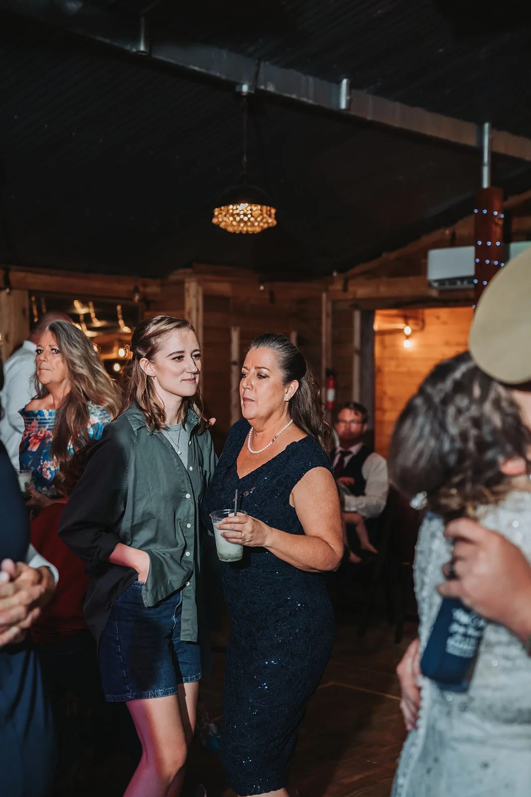 Guests gathered in the hall at SJP Ranch, Cleveland, TX