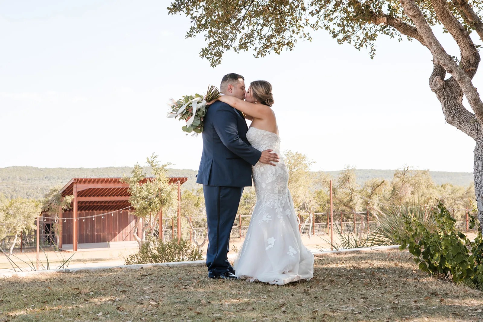 Bride and groom under the oaks at Star Hill Ranch in Austin, TX