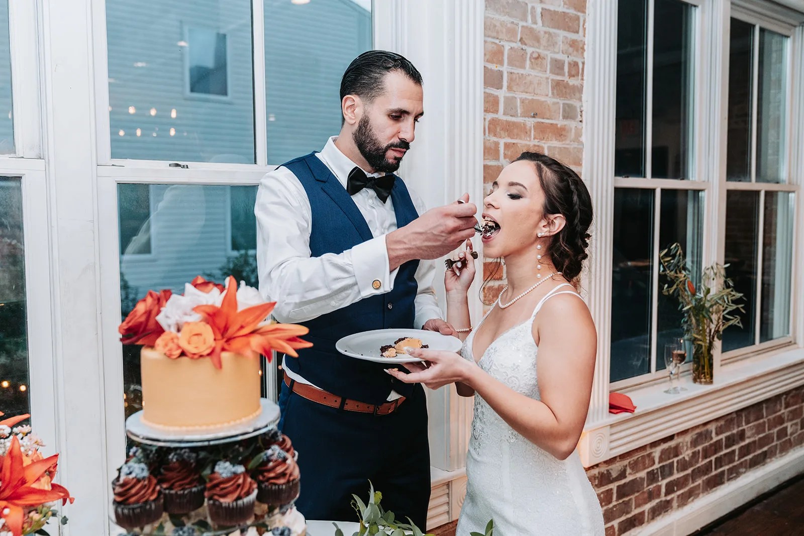 Cake cutting by the window at Station 3 in Houston, TX