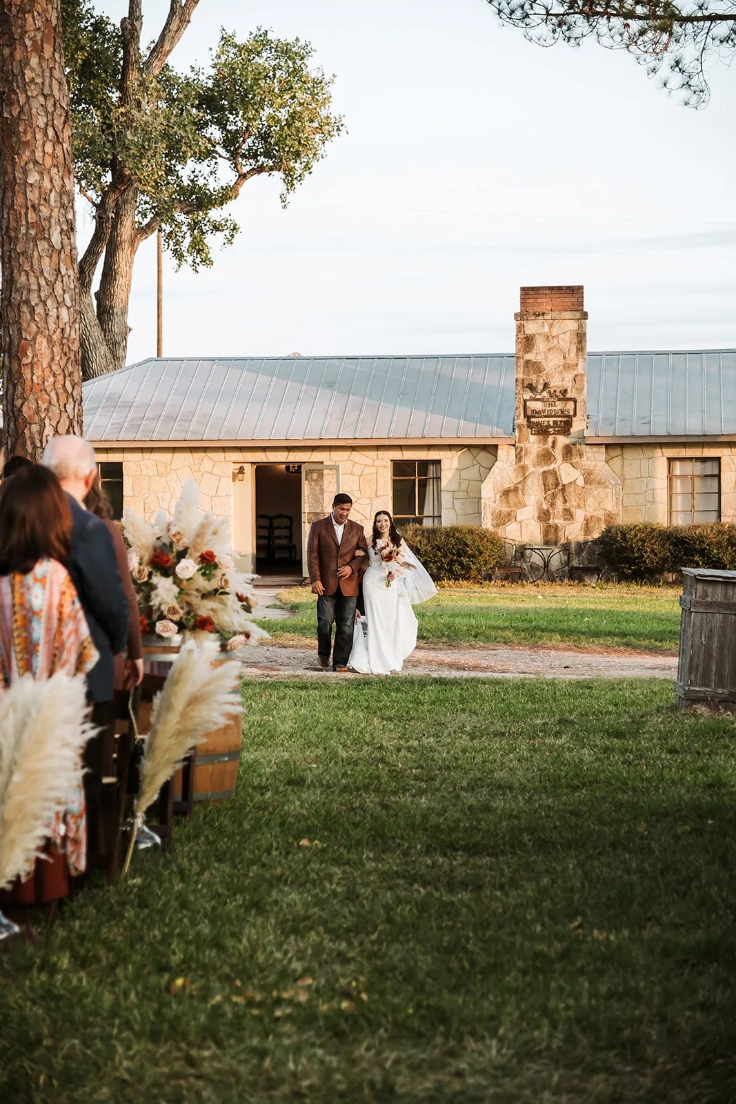 Bride and groom at the ranch house at Strawberry Pines at Strawberry Pines, Poteet, TX