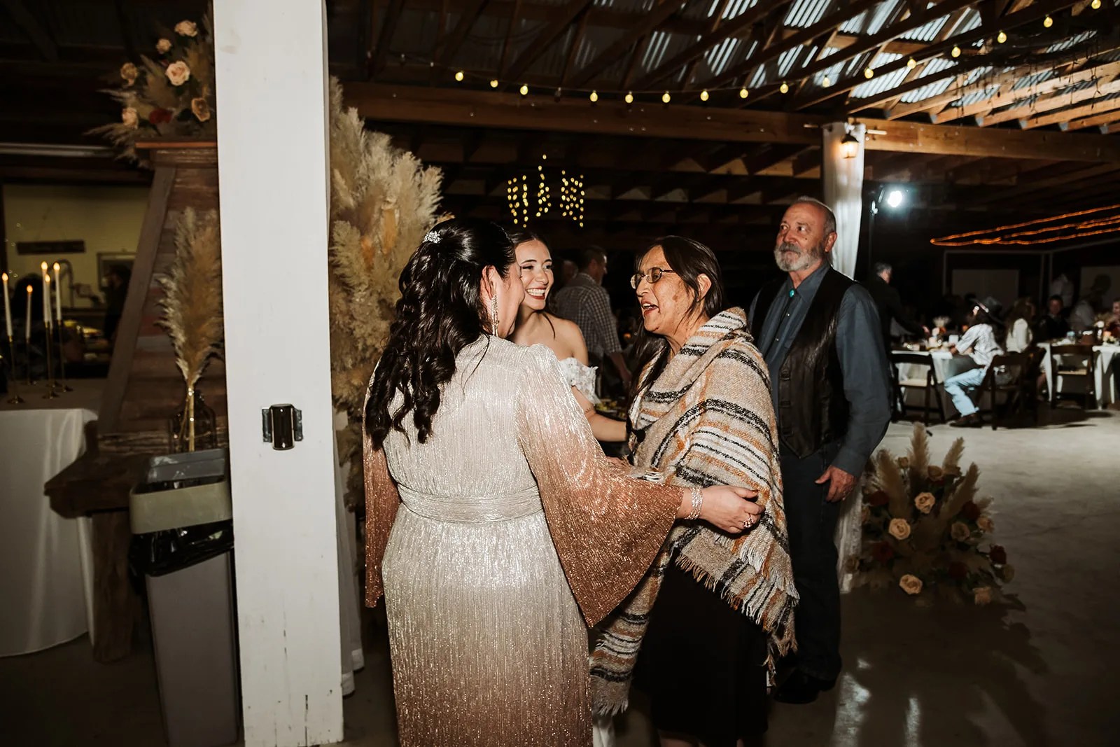 Guests in the hundred year old barn at Strawberry Pines at Strawberry Pines, Poteet, TX