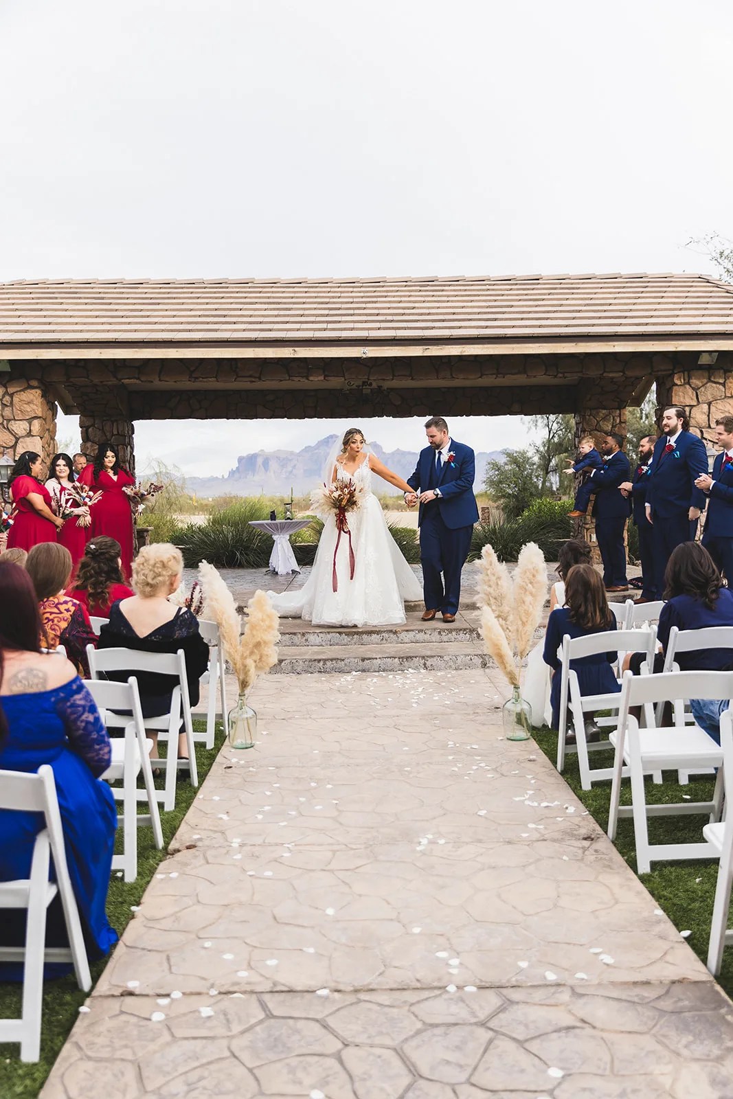 Wedding ceremony with the Superstition Mountains behind at Superstition Manor at Superstition Manor, Mesa, AZ