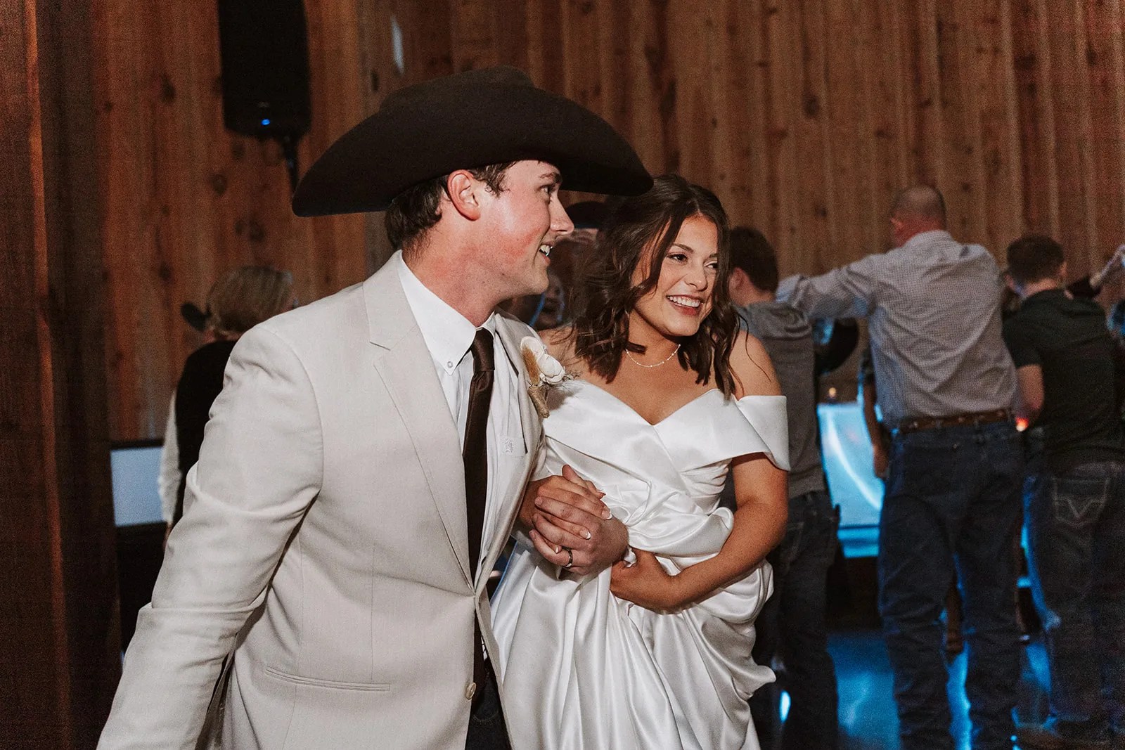 The County Line wedding venue in Abbott, TX, timber hall and dance floor under string lights