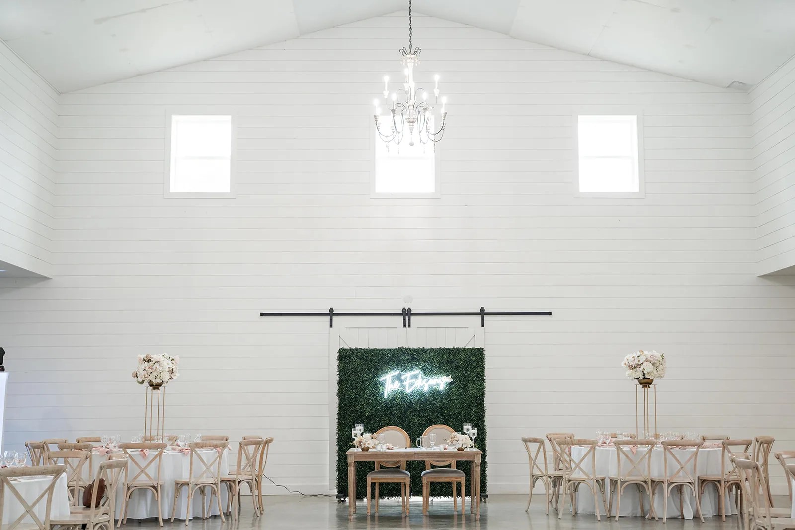 Barn interior set for a wedding reception at The Evermore in Edna, TX