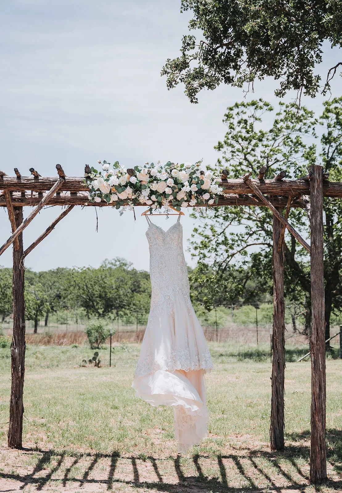The dress hung on the arbor at The Ginger Ranch, Fredericksburg, TX