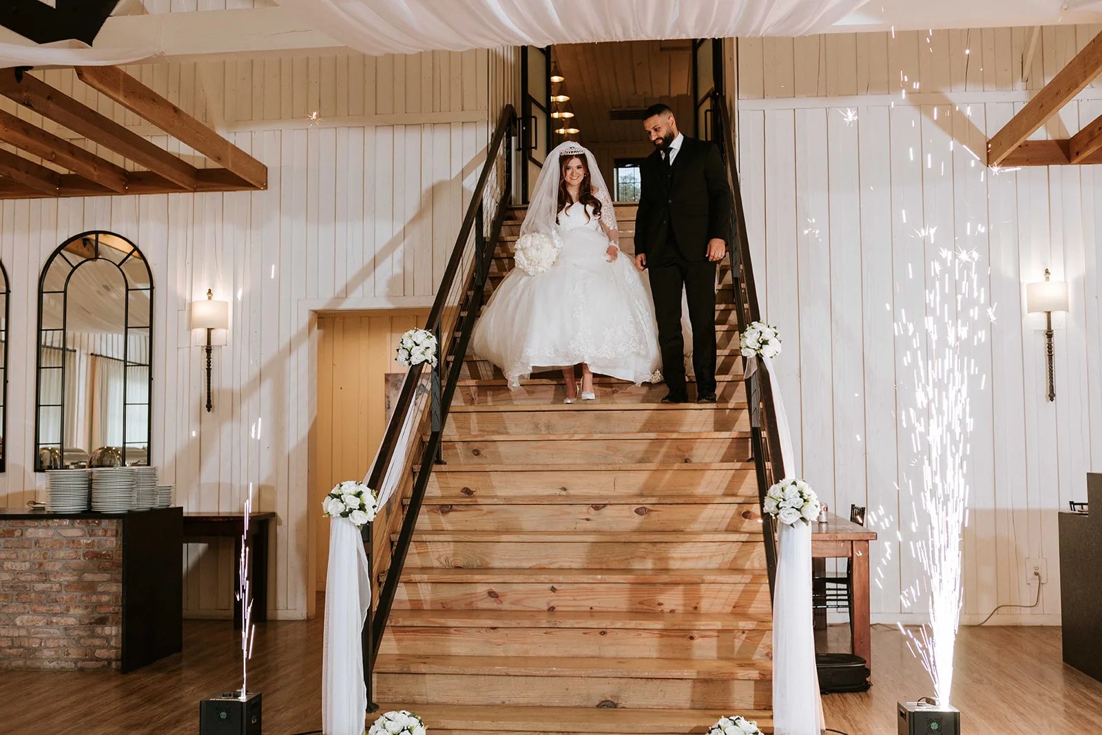 Grand staircase in the shiplap hall at The Milestone Georgetown in Georgetown, TX