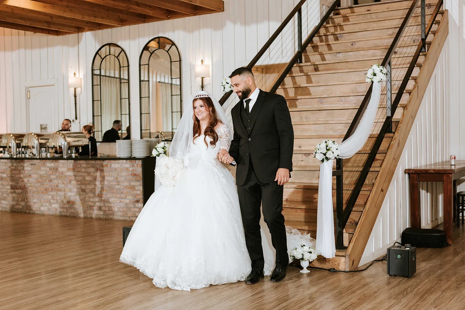 Bride and groom on the staircase at The Milestone Georgetown in Georgetown, TX