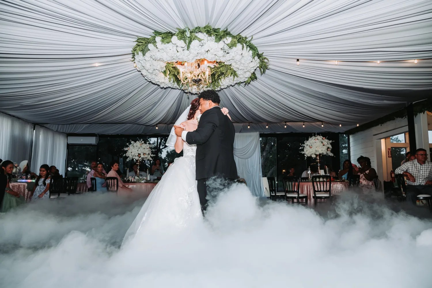 Low fog first dance under the floral chandelier at The Ranch by GMV