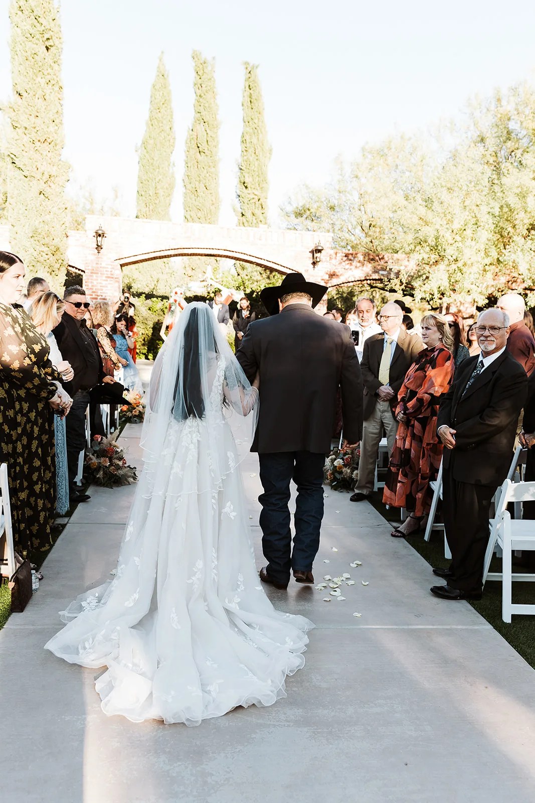 Walking the aisle to the ceremony at The Windmill Winery, Florence, AZ
