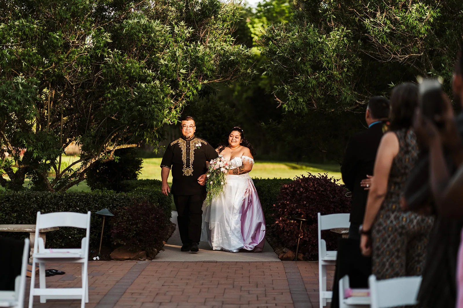 Tuscan Courtyard wedding venue in Dickinson, TX, outdoor ceremony under the pergola