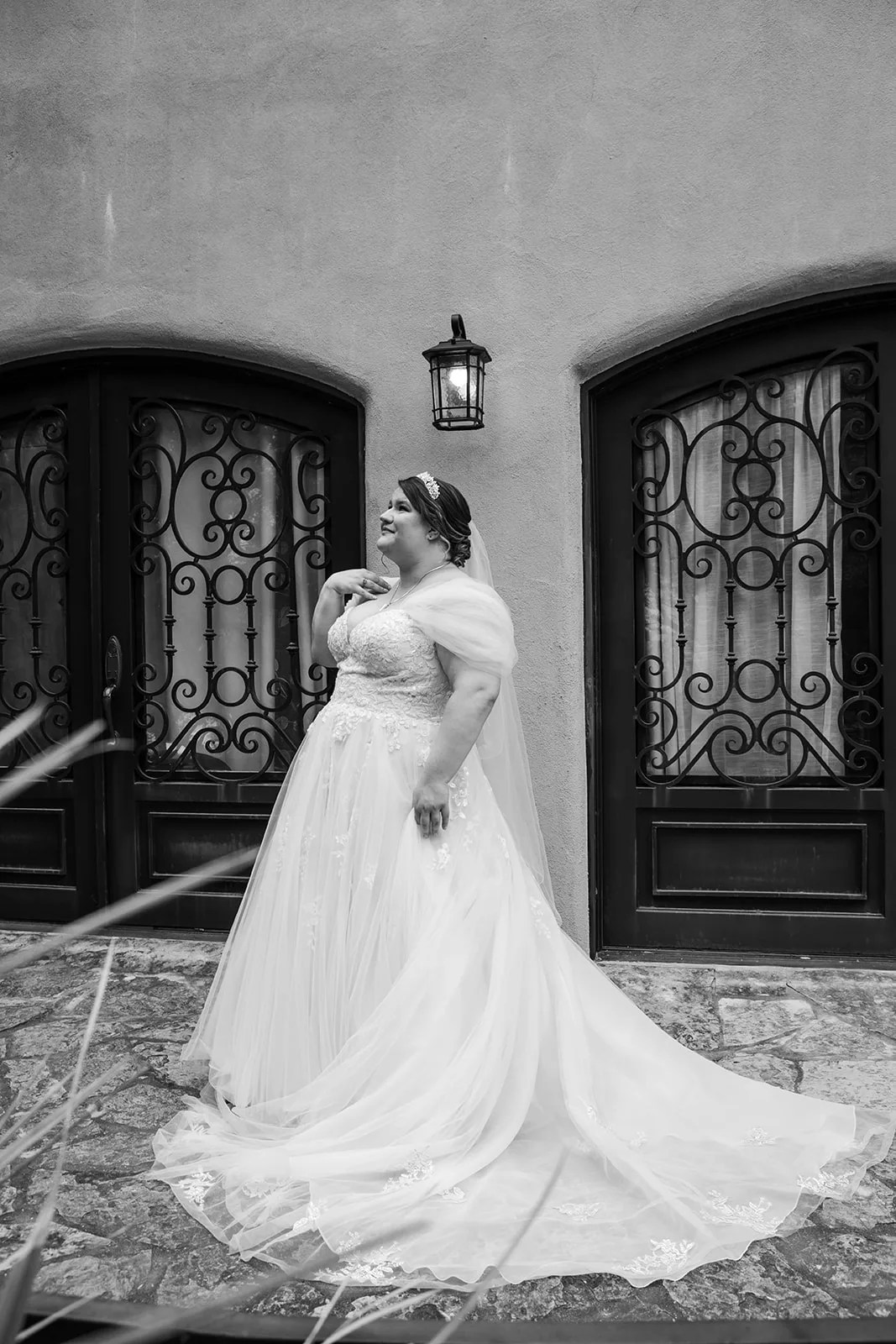 Bride at the wrought iron doors at Tuscan Hall, Austin, TX