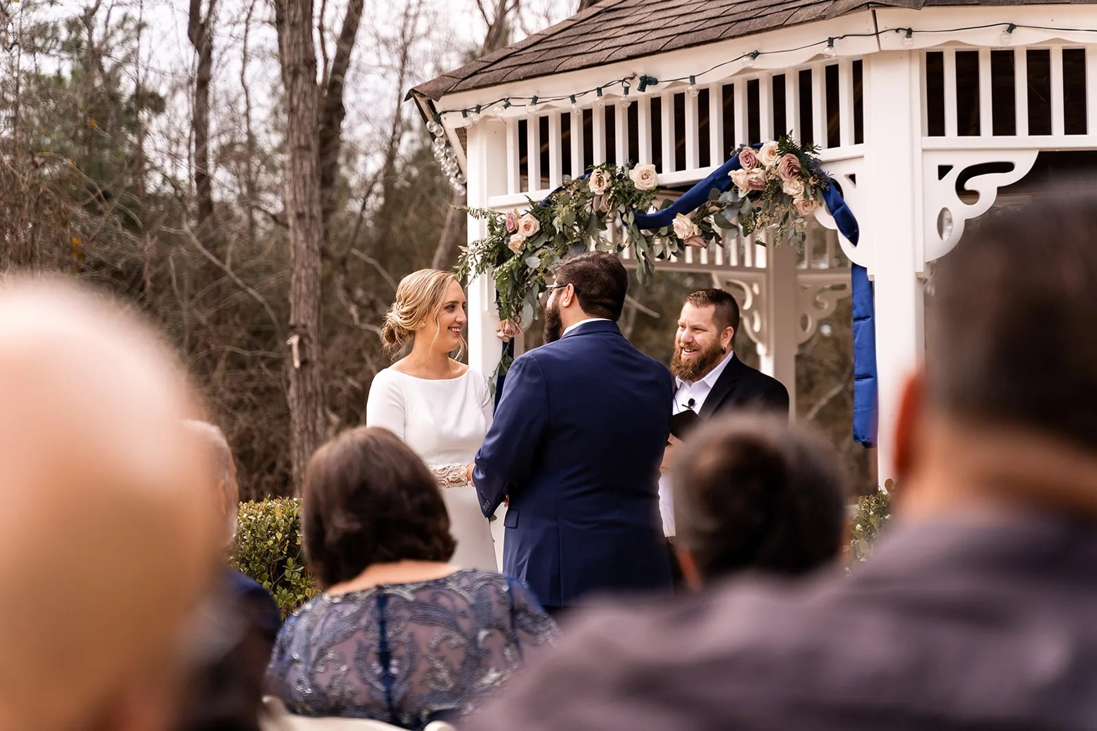 Wedding ceremony outside the manor at Waverly Manor in New Waverly, TX