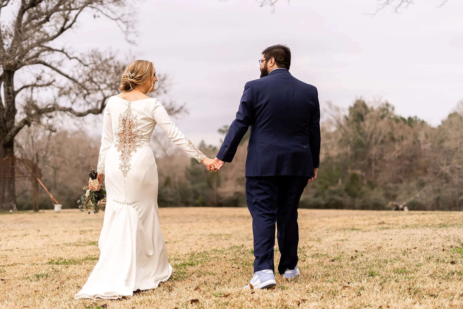 Bride and groom on the lawn at Waverly Manor near Huntsville, TX