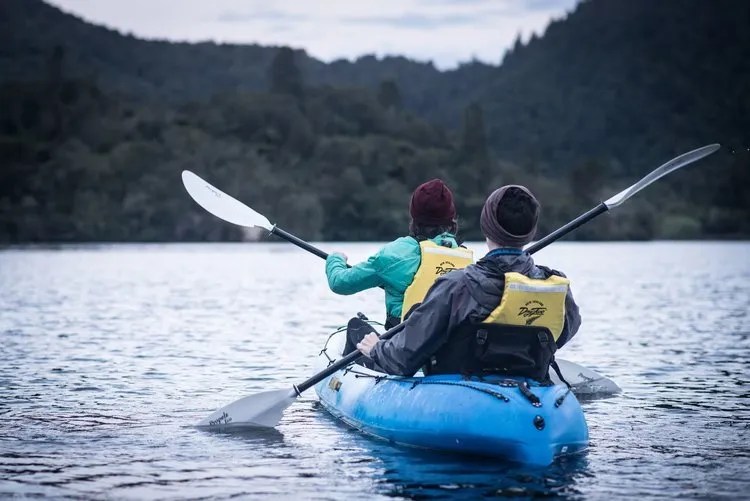 two people kayaking on lake okareka with paddle board rotoura