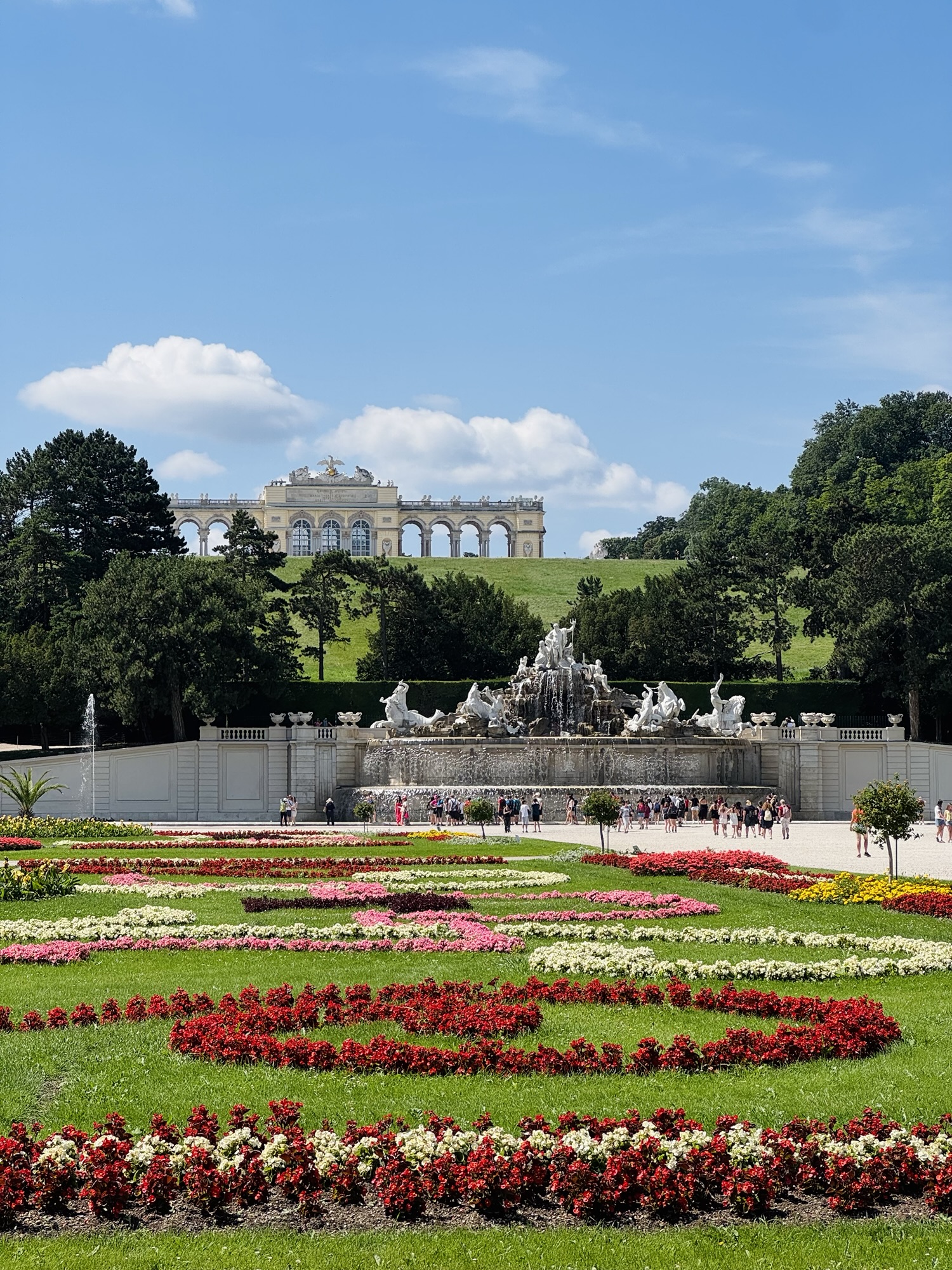 Schönbrunn Palace gardens, Neptune fountain, and Gloriette in Vienna Austria