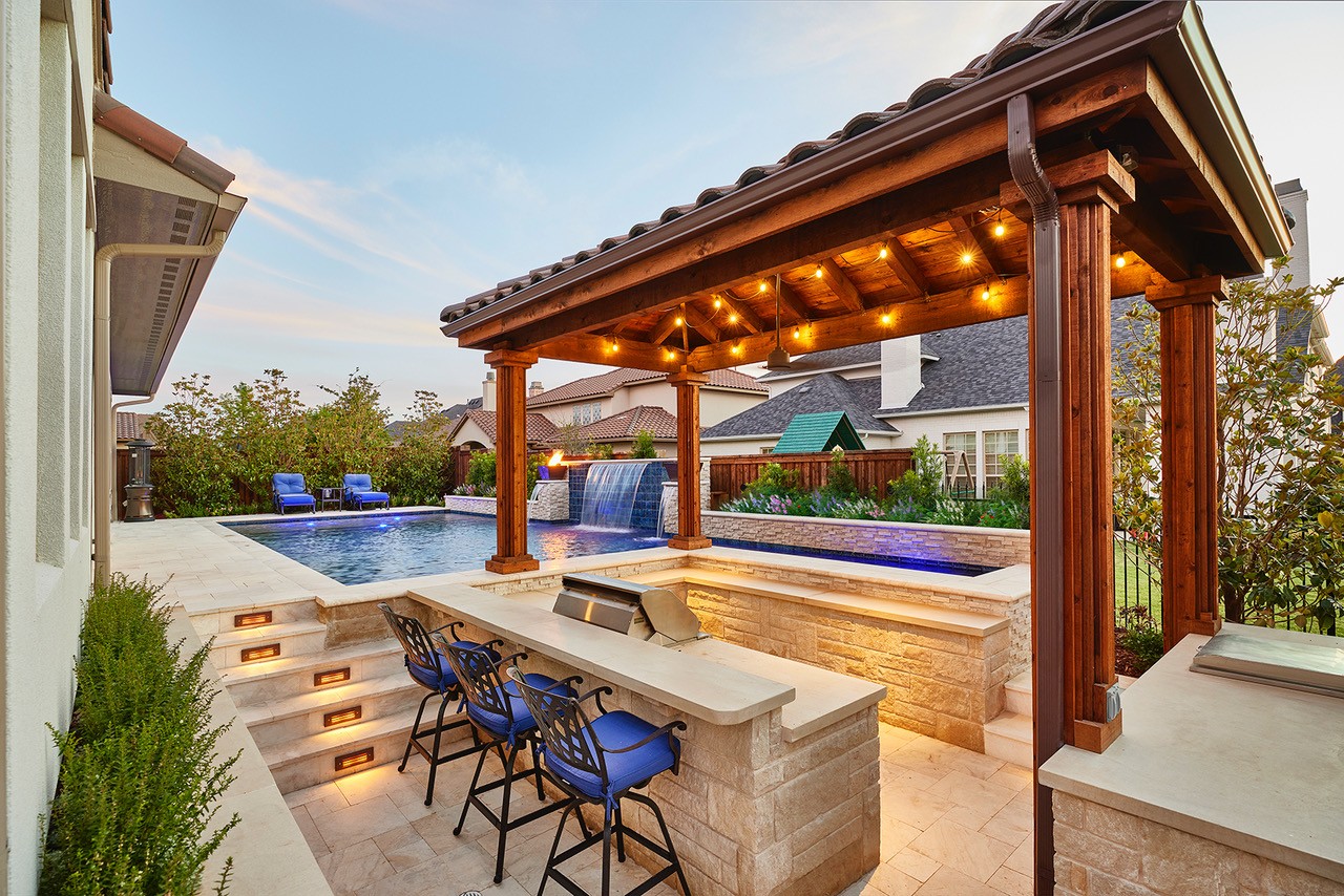 Weisz Selection Landscape and Pools -recessed outdoor kitchen next to a pool