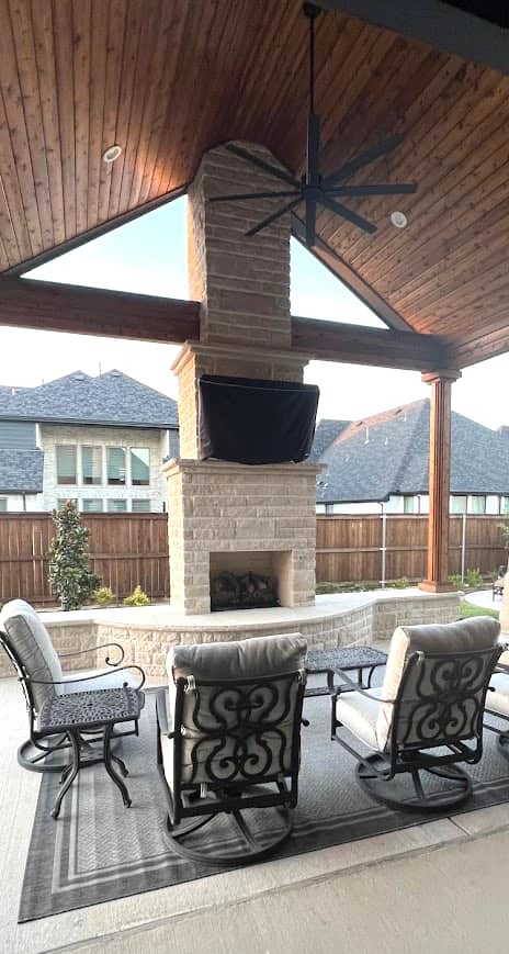 Weisz Selection - stone and wood pavilion with seating area and fireplace