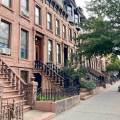 Brownstones in Brooklyn. A tree is on the sidewalk.