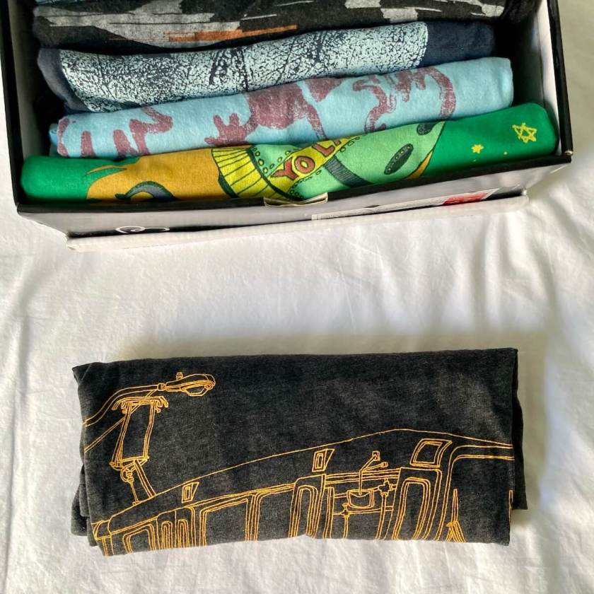 A t-shirt folded up into a small rectangle