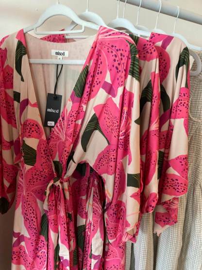Closeup of the pink lily print on a dress