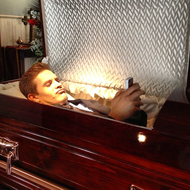 man in coffin is still texting Halloween 2013