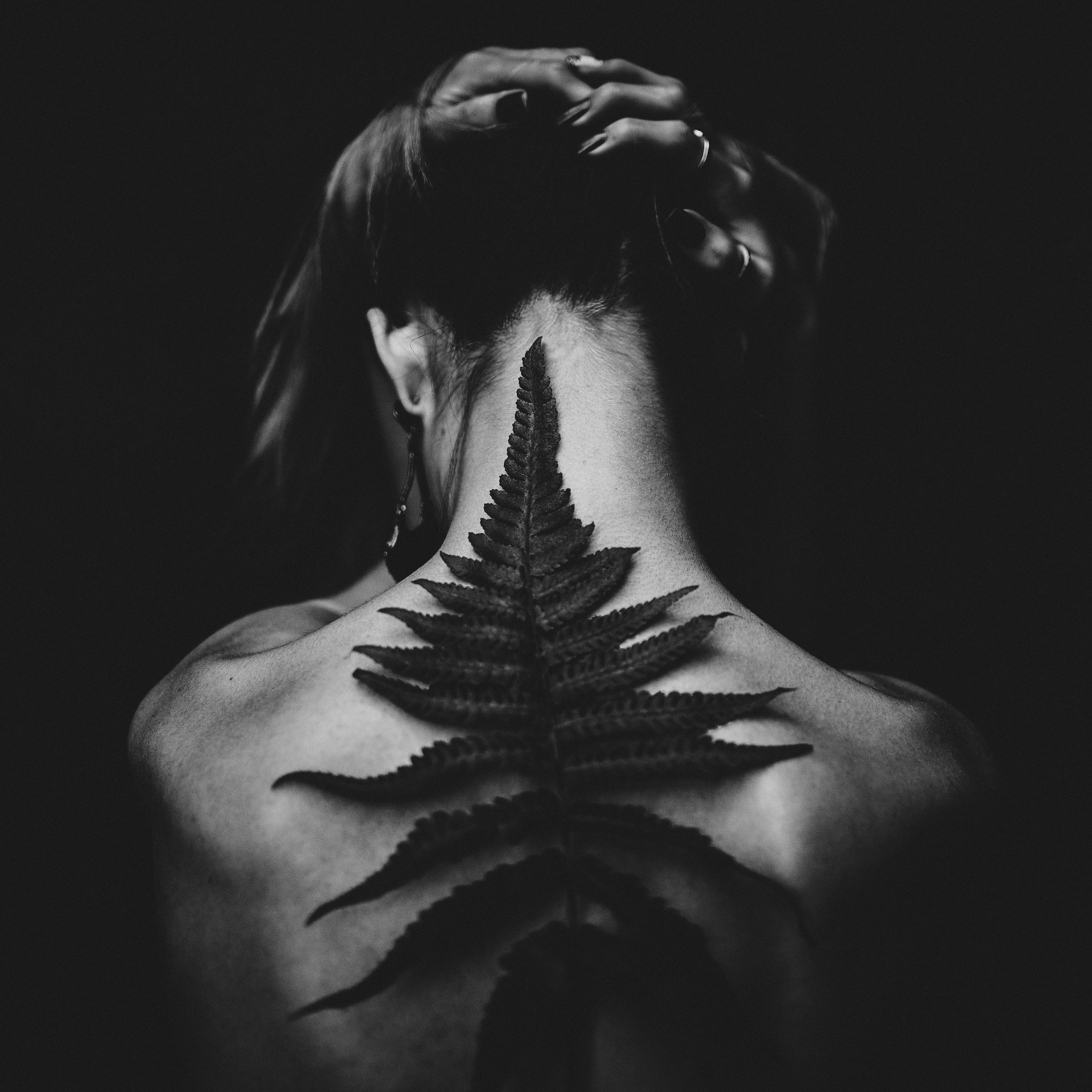 Girl with leaf on her back
