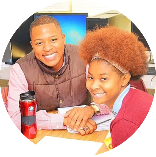 Teacher and student smiling