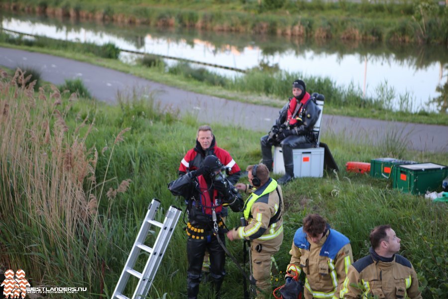 Person in Water at Auction Road Firefighters packing up equipment