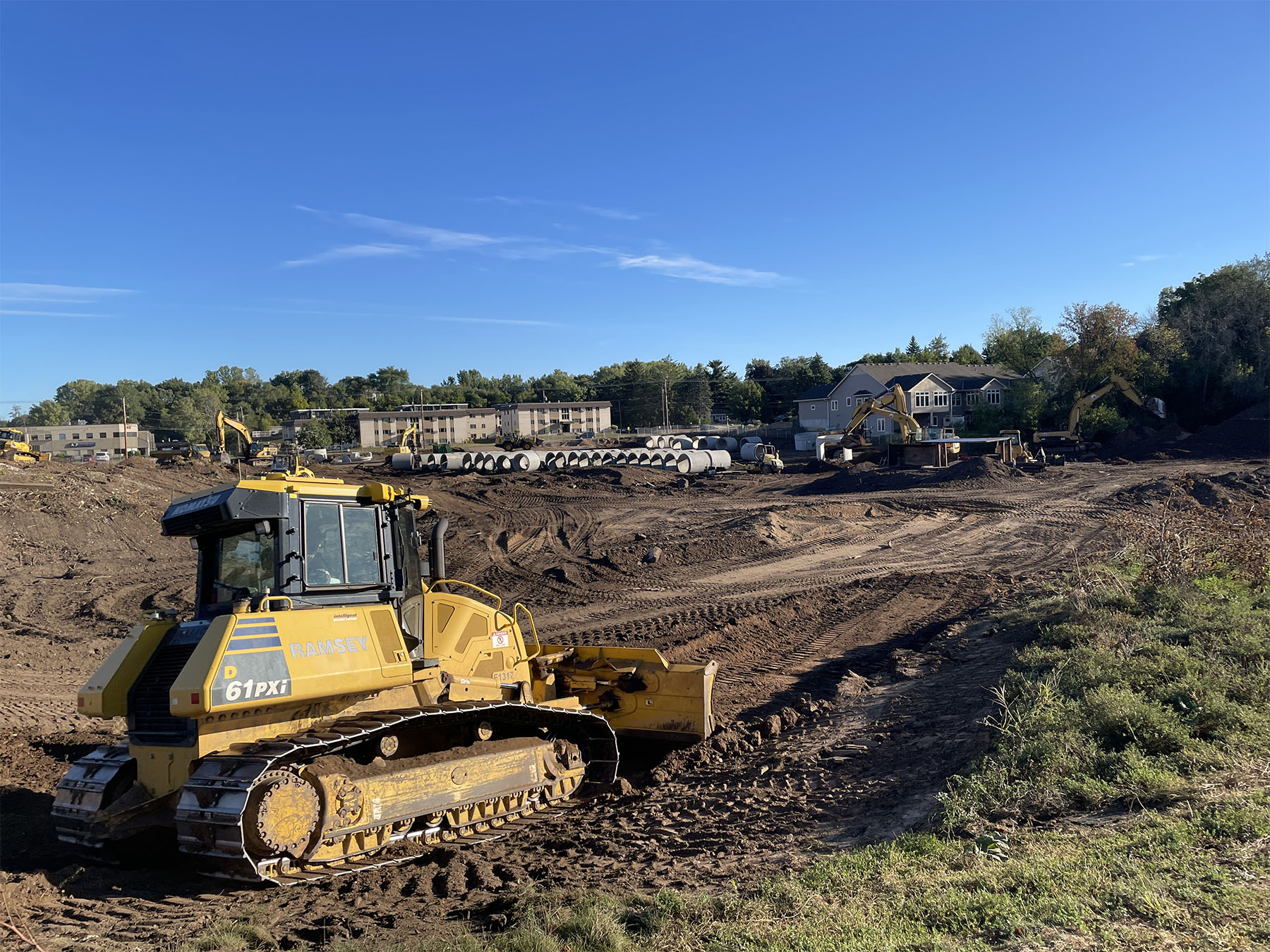 Bulldozer moving dirt at 150 Thompson site in West St. Paul.