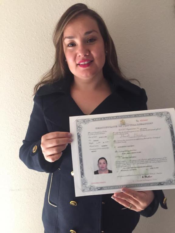 Maria Molina with citizenship certificate.