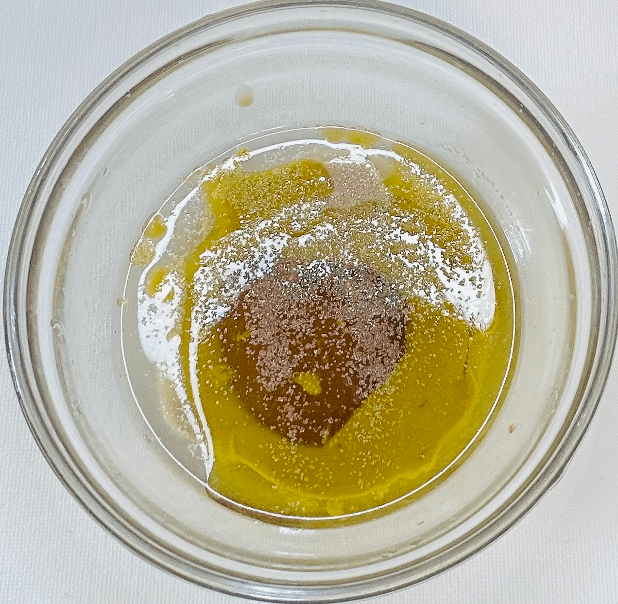 Olive oil with tahini, maple syrup, lemon, garlic granules and salt