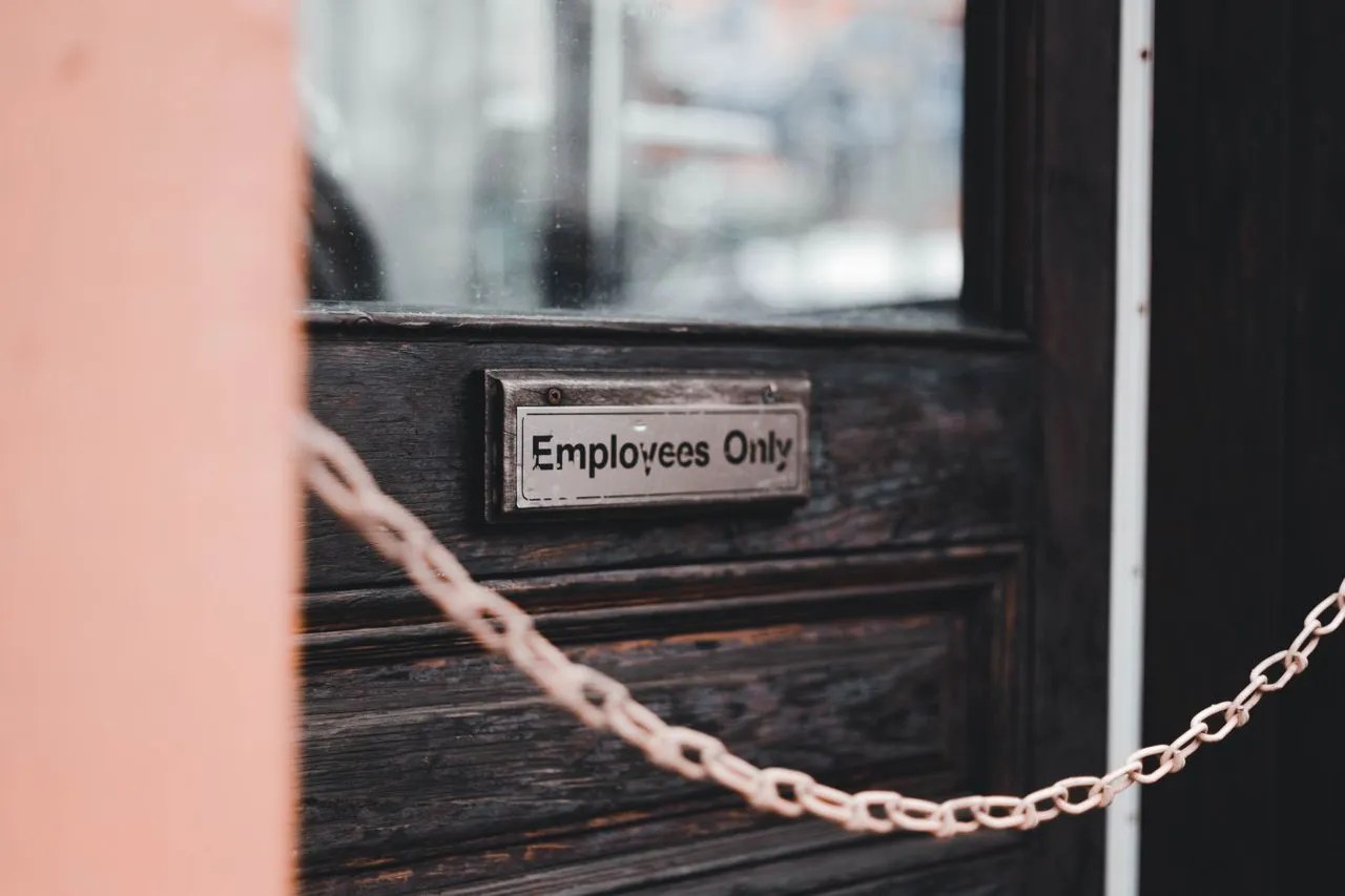 Employees Only sign on a workplace door