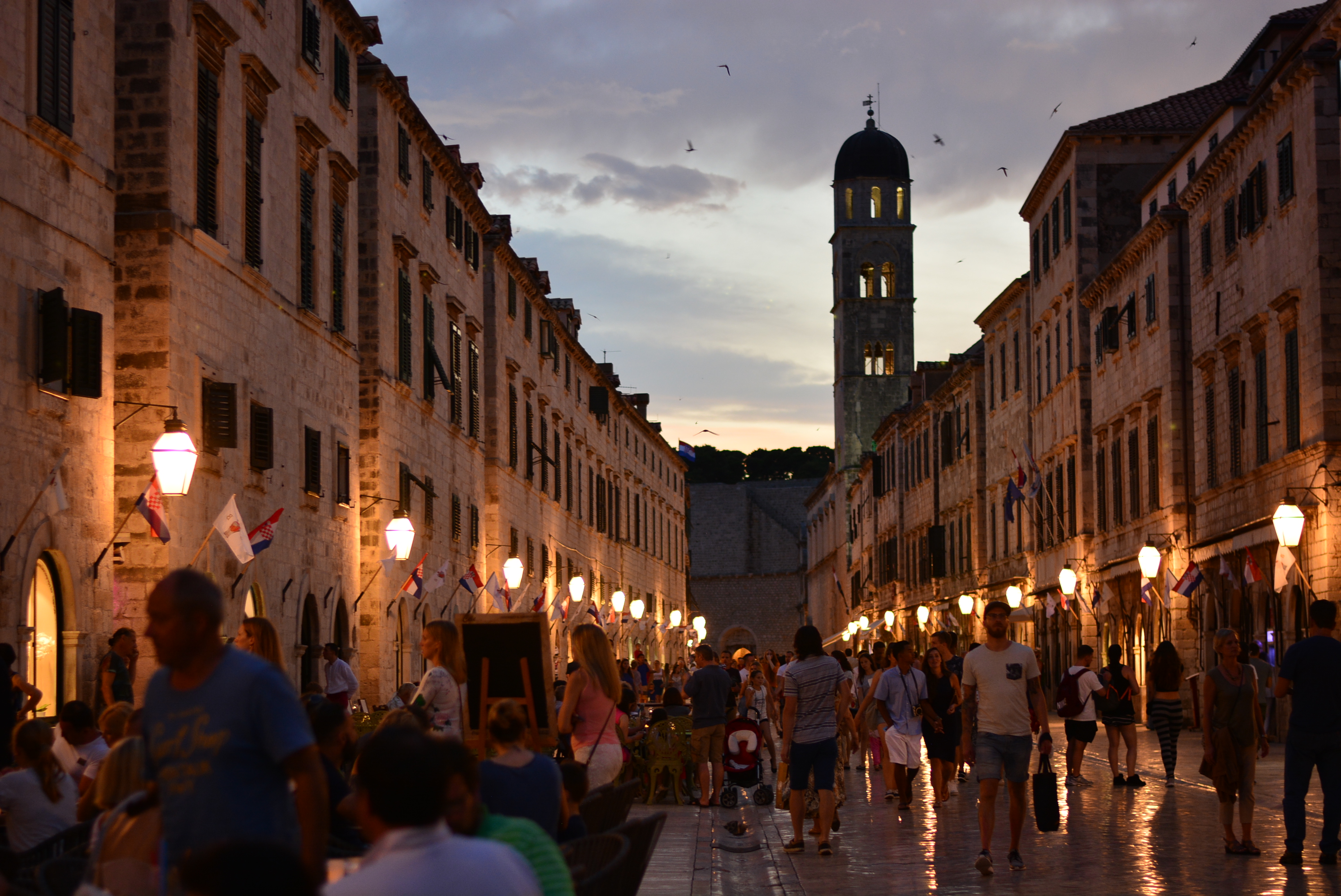 a blurred photo of Dubrovnik at night.