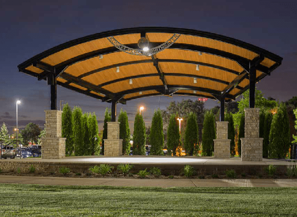 Steel amphitheater providing shade and shelters for outdoor events and gatherings.