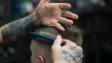 person combing person s hair