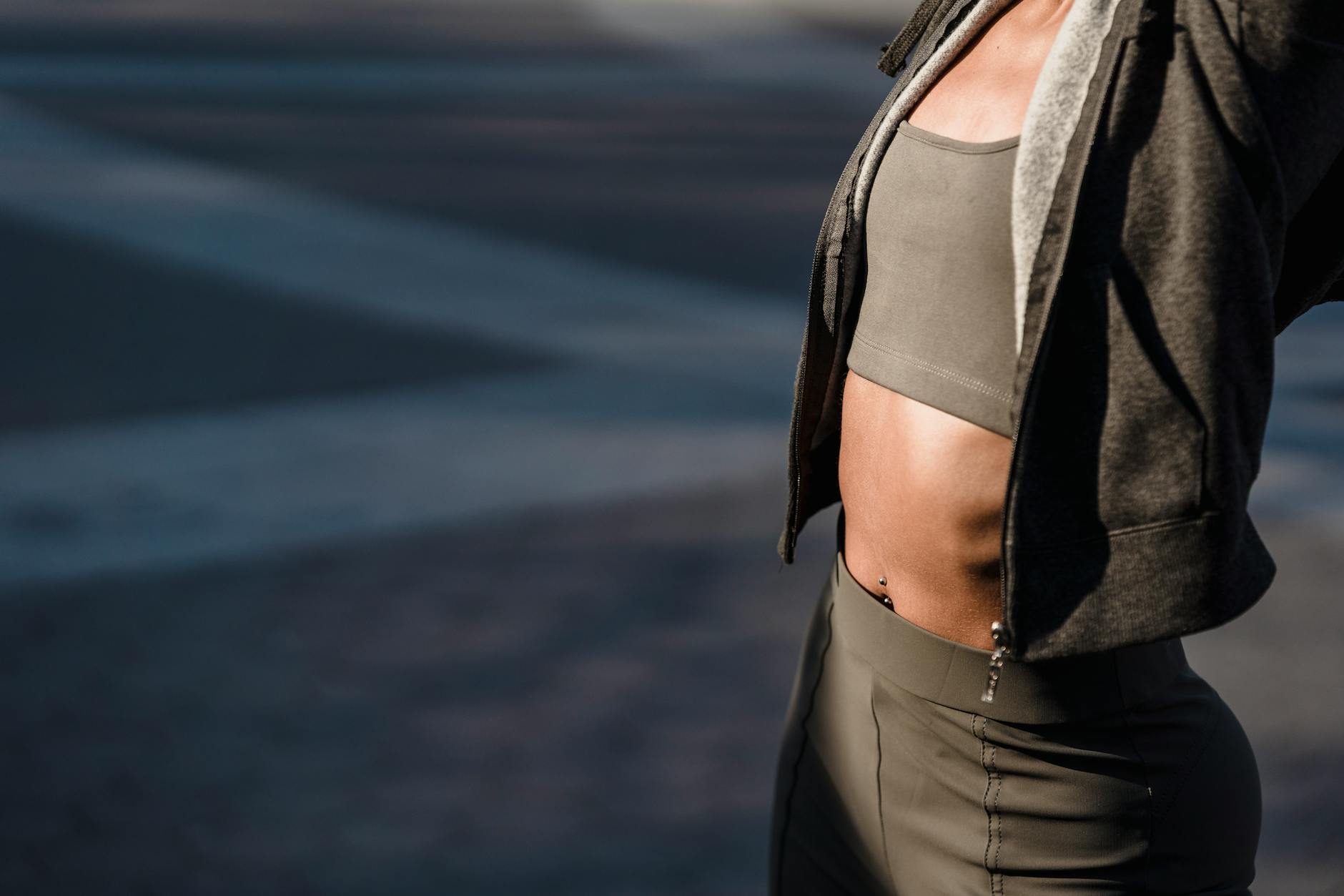 unrecognizable woman in sportswear on street