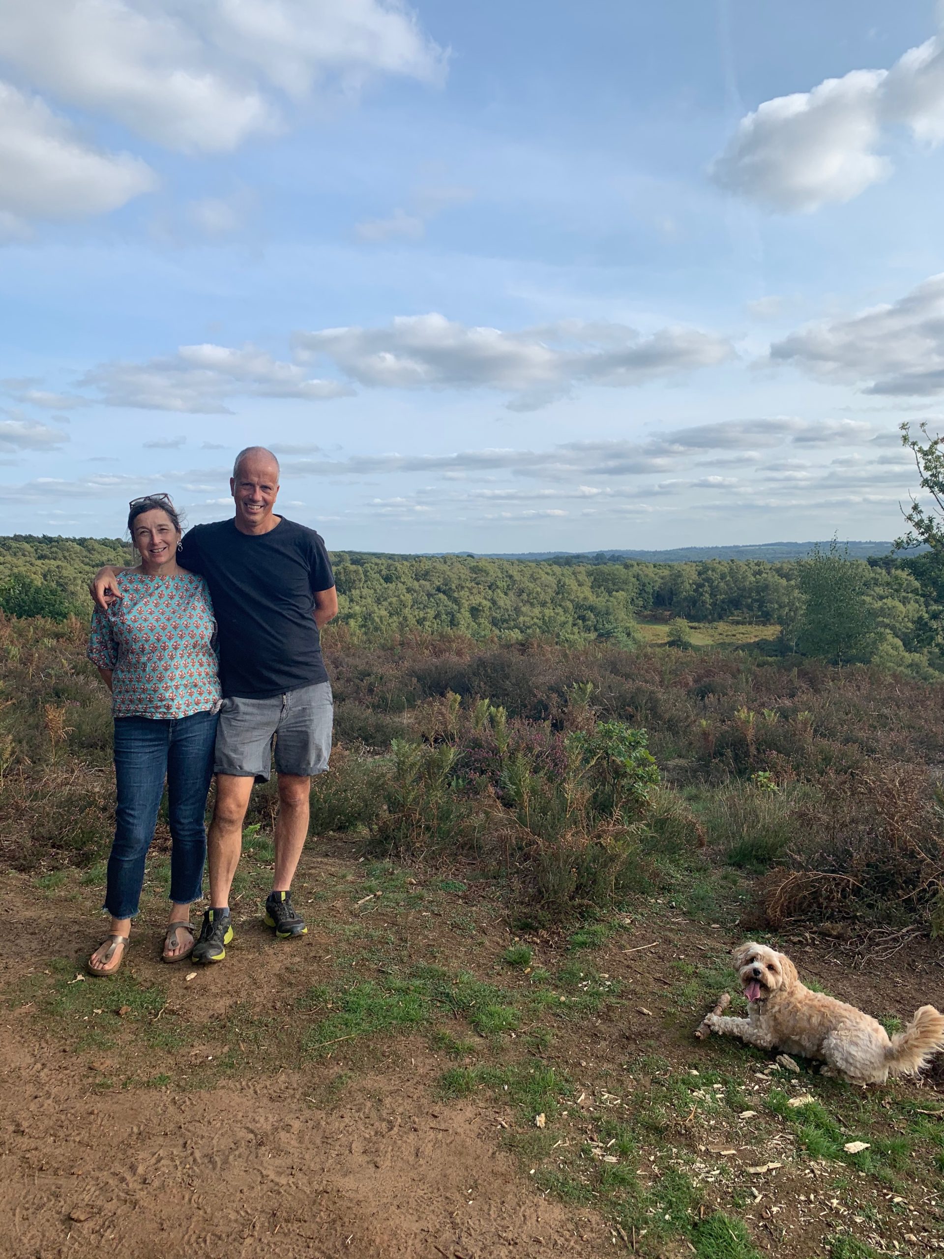 Photo of the owners of White House Cottages overlooking hills