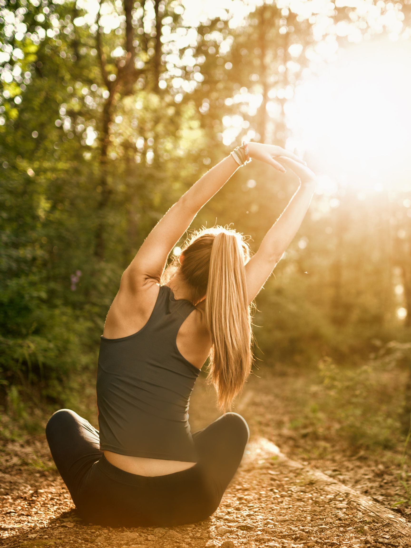 Women sitting on the ground in sunlight cycle syncing