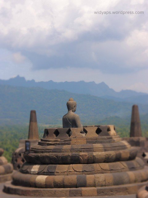 Buddha statue inside the broken stupa