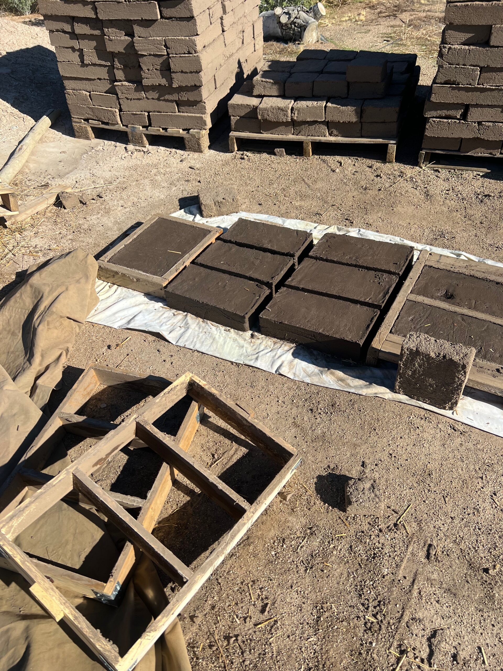 Adobe brick forms and drying permaculture forms