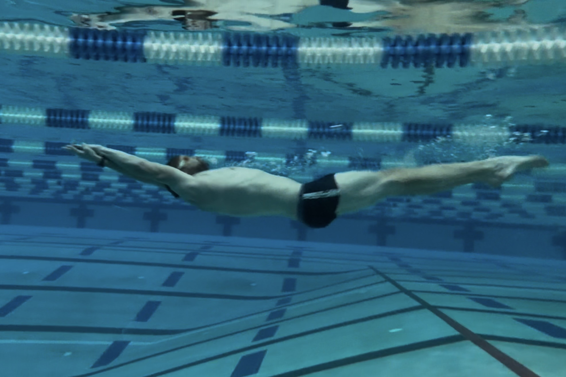 Bill Senese swimming backstroke underwater during Week 8 of his training for USMS Nationals